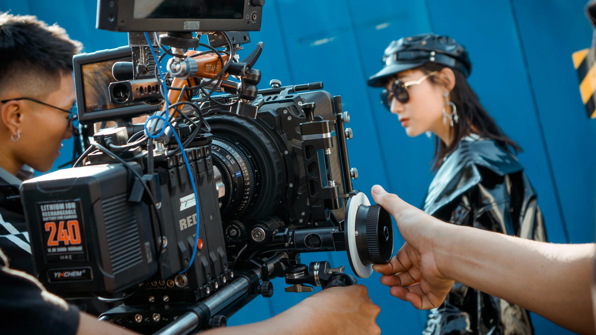 Cinematographer operating a RED camera on set